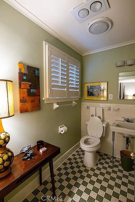 2751 Toxey Drive Raleigh, NC 27609 - Photo 32 of 41 a bathroom with a toilet sink and mirror
