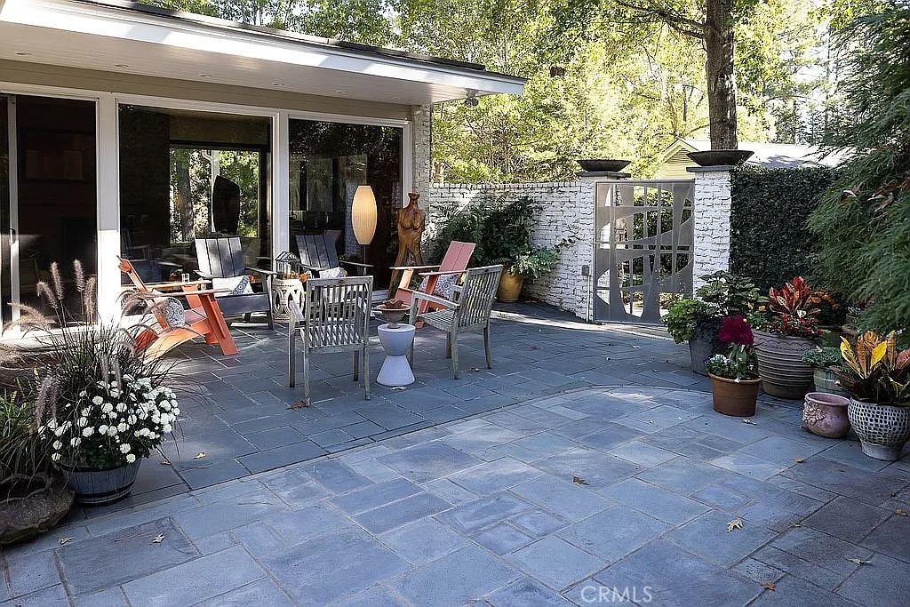 2751 Toxey Drive Raleigh, NC 27609 - Photo 37 of 41 a view of a patio with chairs and potted plants