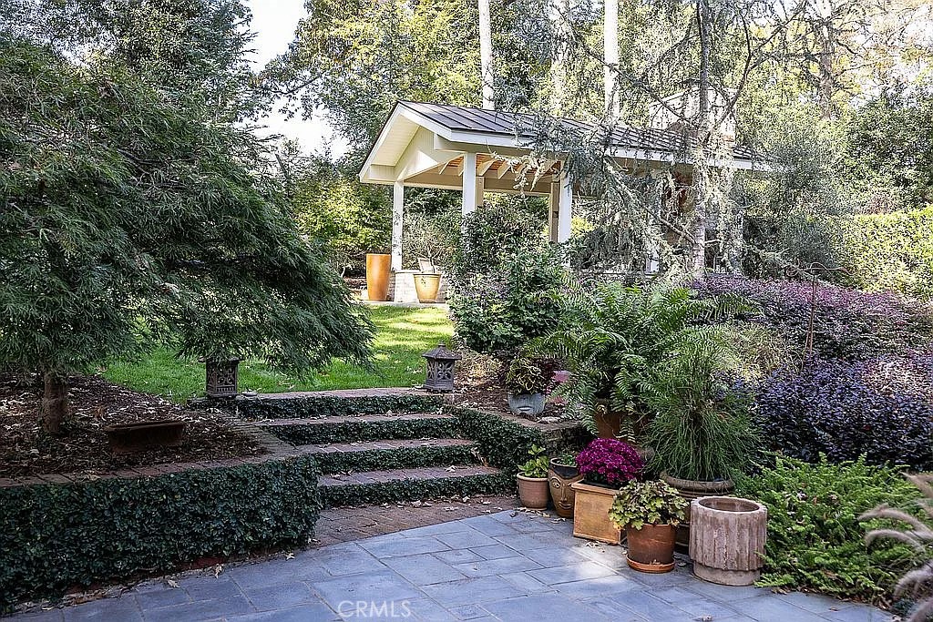 2751 Toxey Drive Raleigh, NC 27609 - Photo 39 of 41 a front view of a house with a yard and fountain
