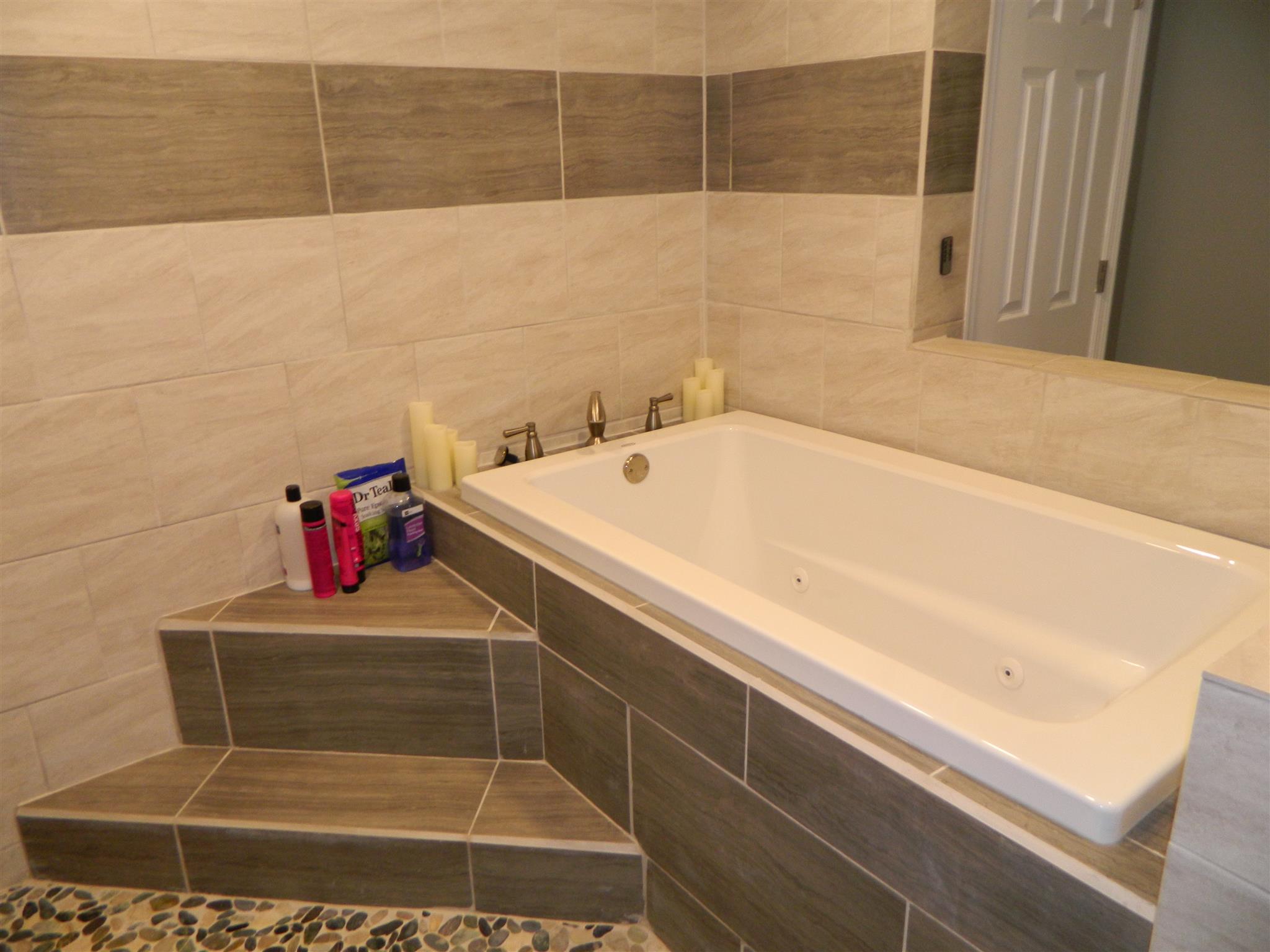 491 Pee Dee Branch Road Cottontown, TN 37048 - Photo 18 of 30 a bathroom with a bathtub and shower