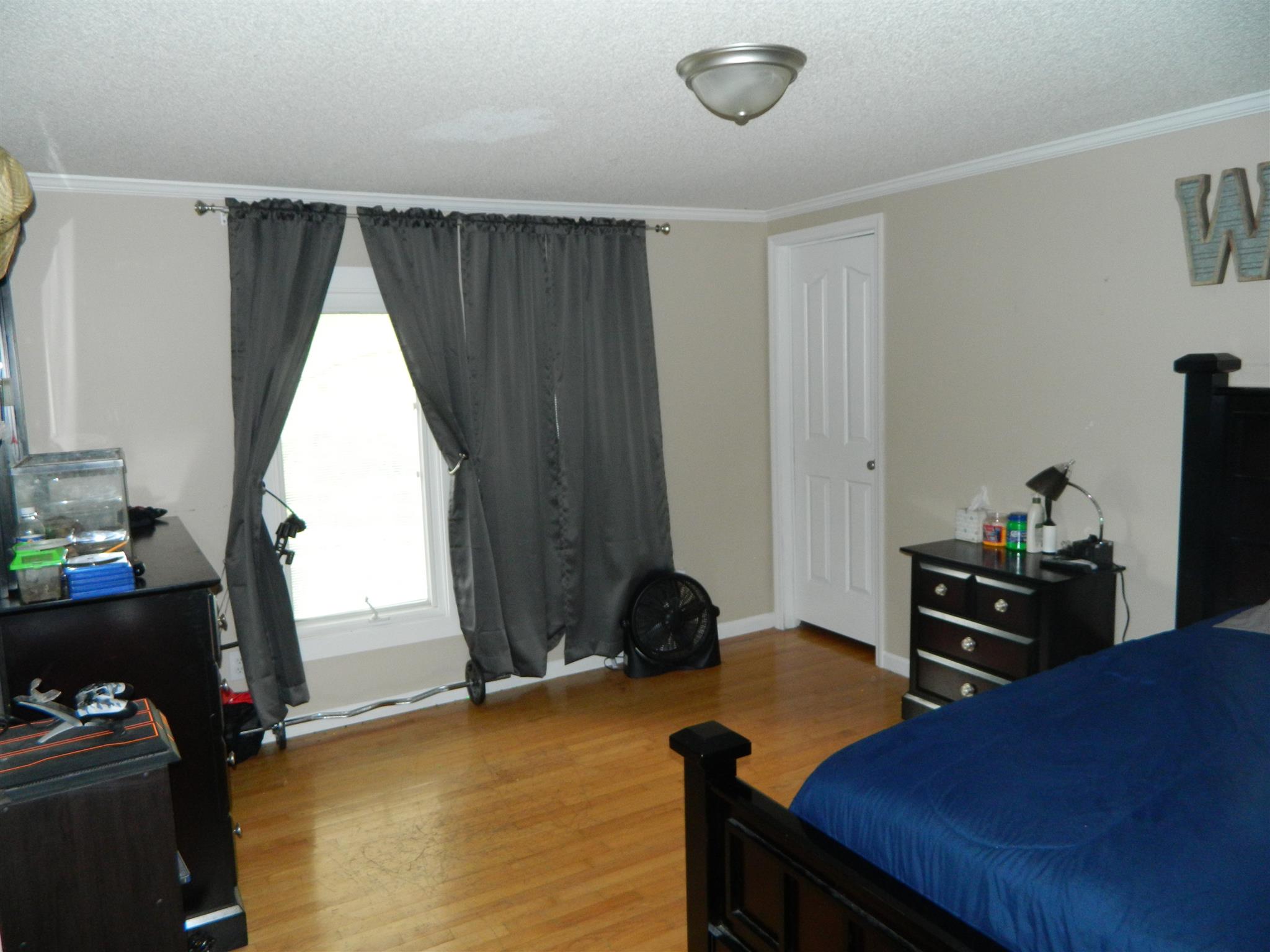 491 Pee Dee Branch Road Cottontown, TN 37048 - Photo 21 of 30 a bedroom with a bed and a window