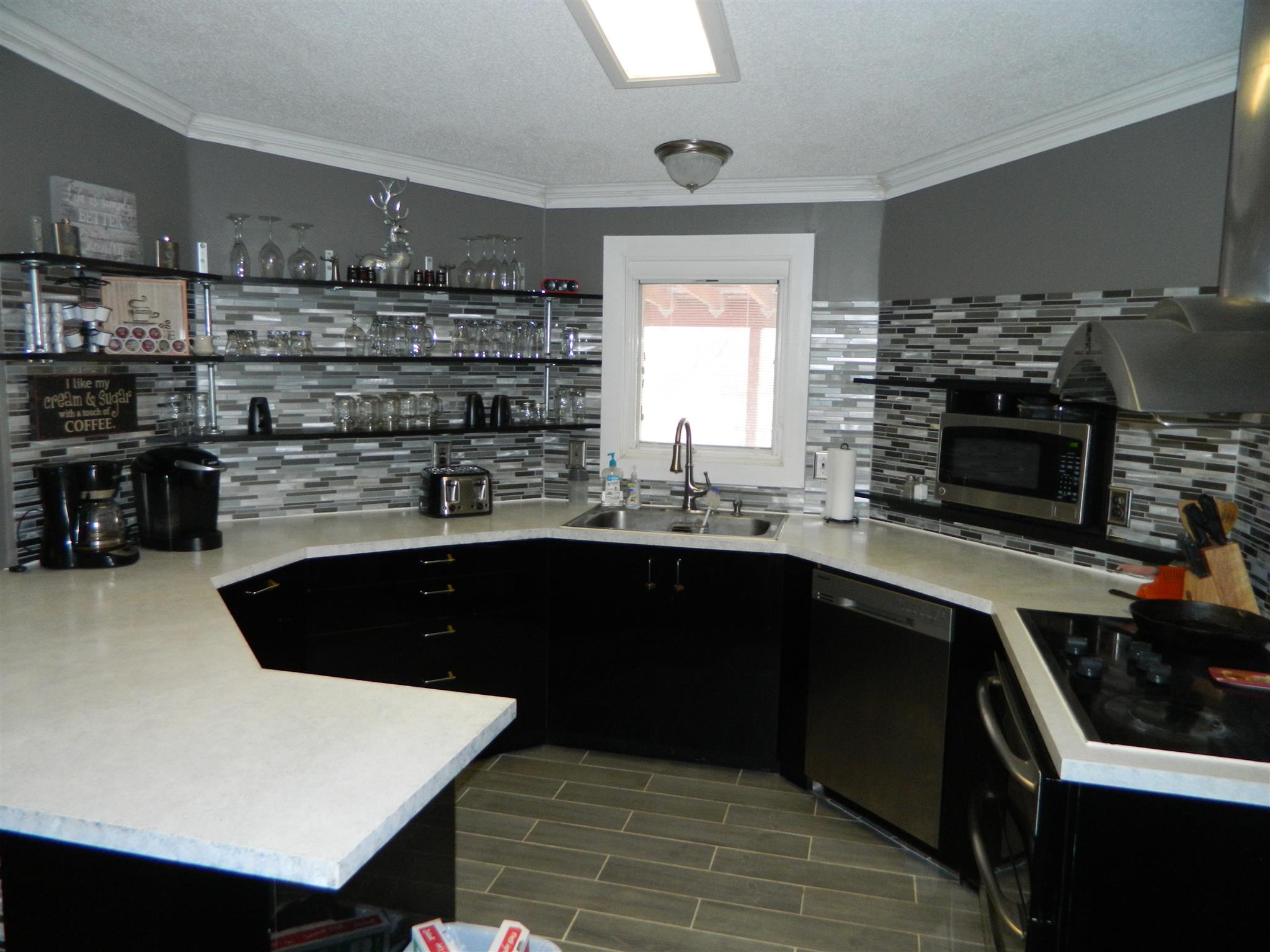 491 Pee Dee Branch Road Cottontown, TN 37048 - Photo 24 of 30 a kitchen with a sink and cabinets