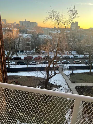 a view of a balcony with an outdoor seating