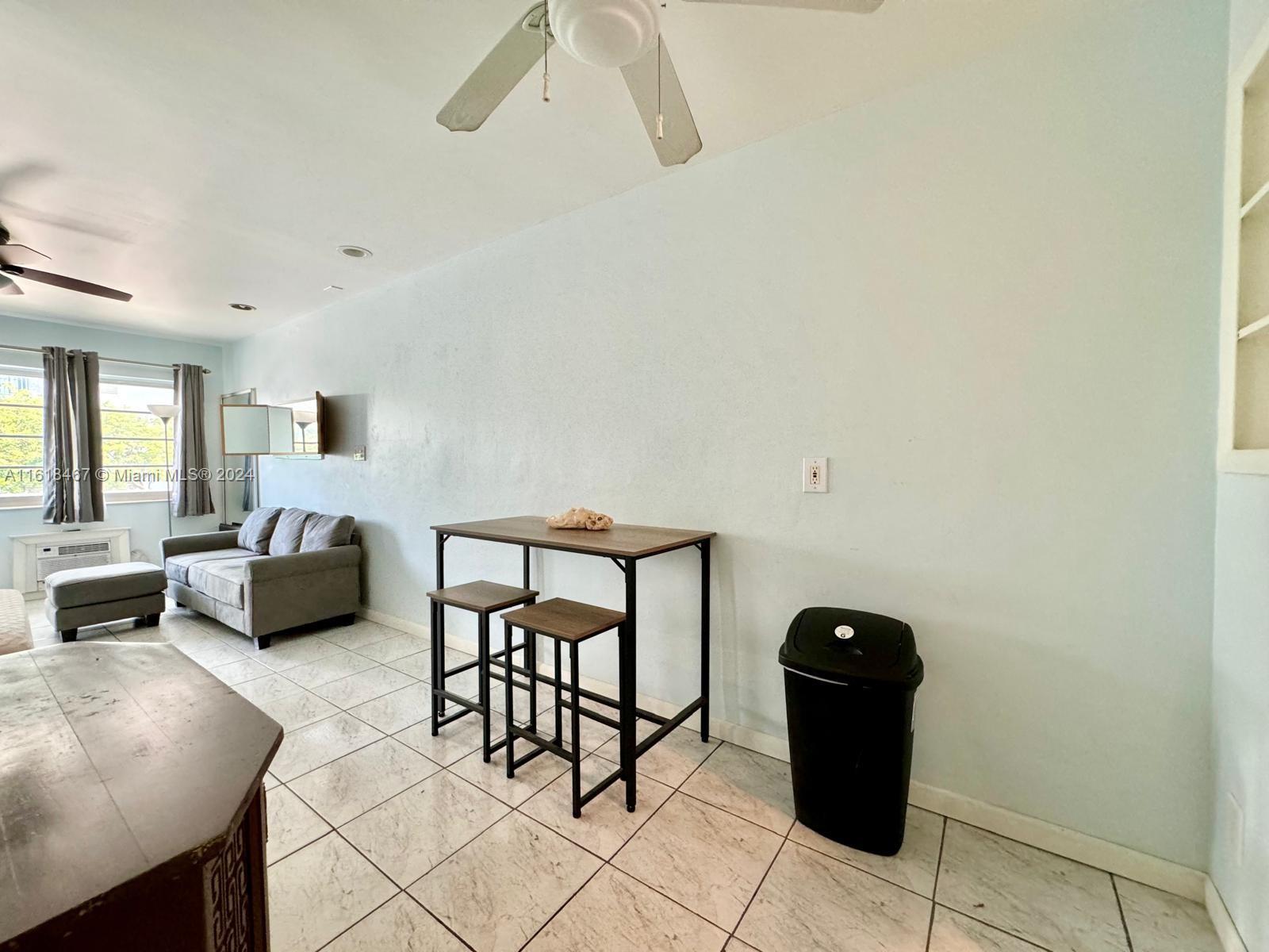 200 76th Street, Unit 52 Miami Beach, FL 33141 - Photo 11 of 16 a living room with furniture