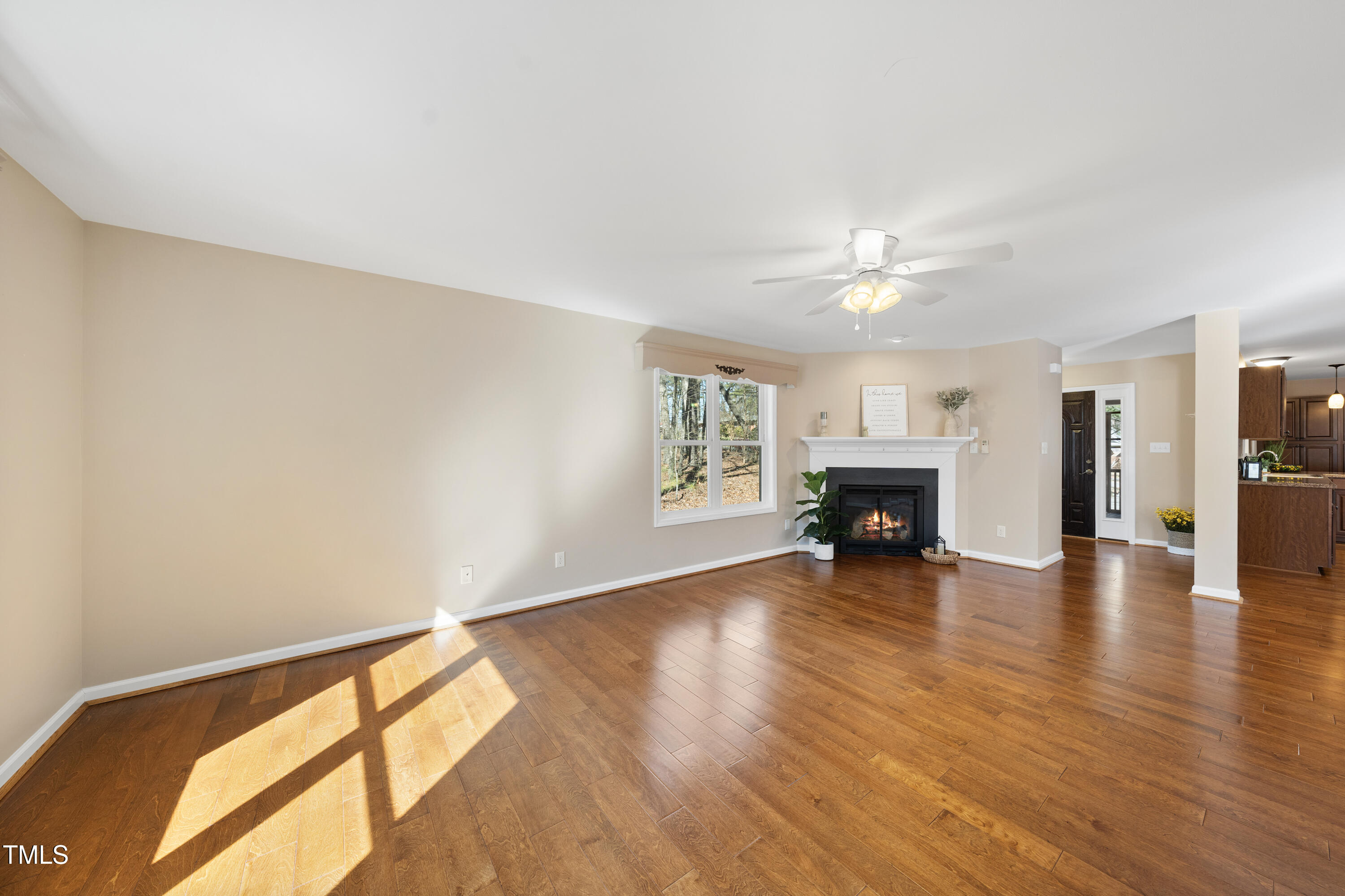 6301 King Lawrence Road Raleigh, NC 27607 - Photo 14 of 79 a view of livingroom with hardwood floor and a ceiling fan