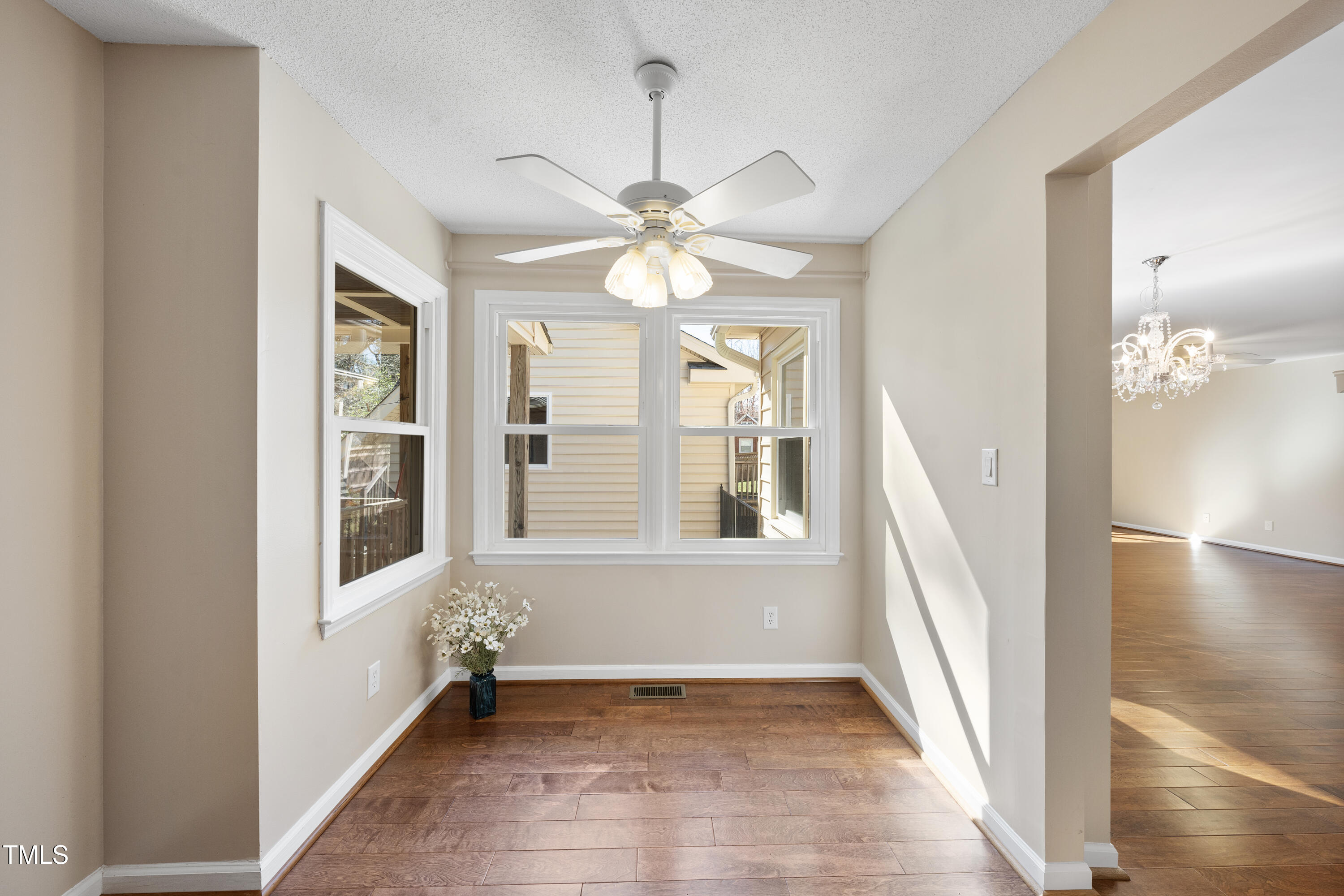 6301 King Lawrence Road Raleigh, NC 27607 - Photo 22 of 79 wooden floor in an empty room with a window