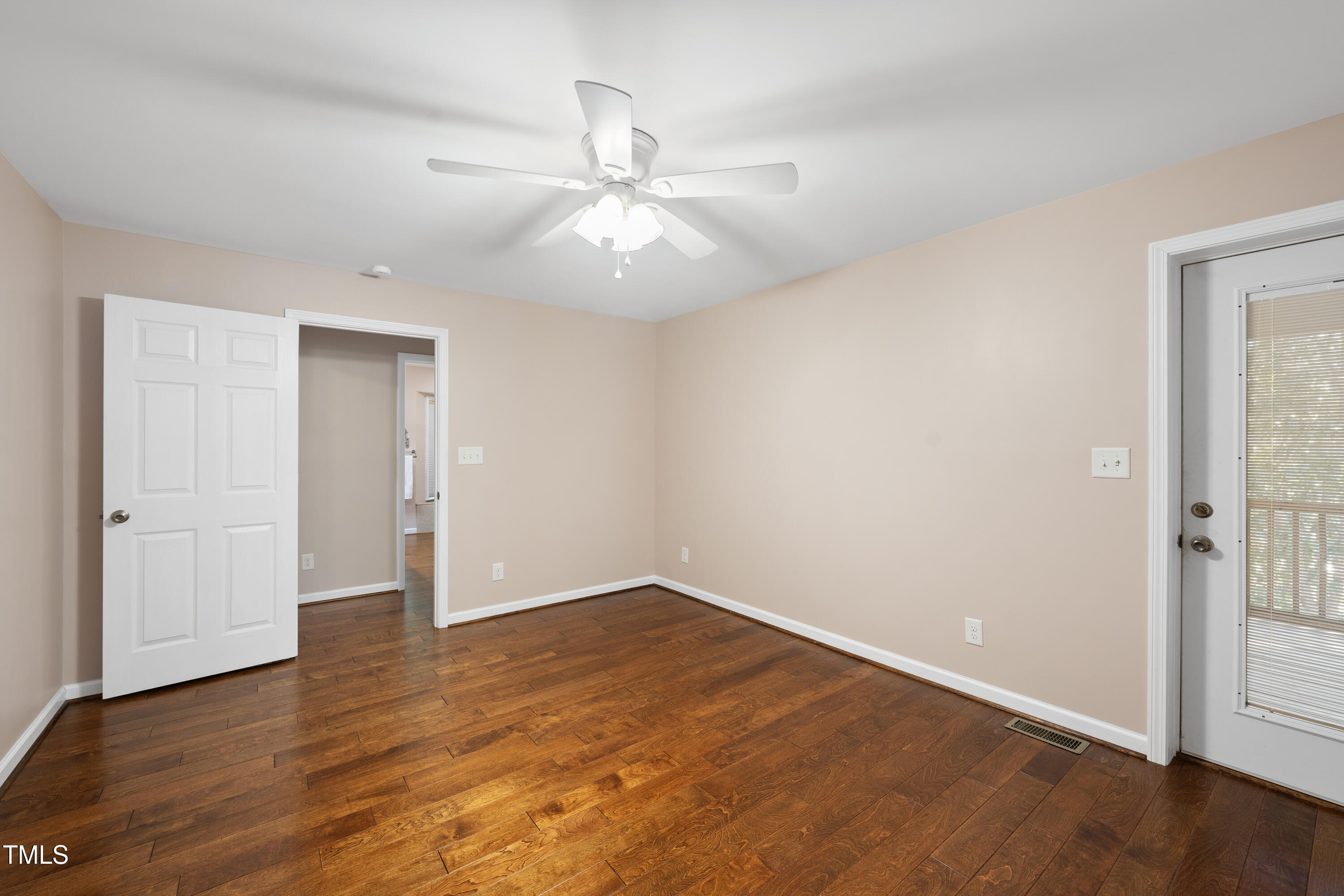 6301 King Lawrence Road Raleigh, NC 27607 - Photo 25 of 79 an empty room with wooden floor fan and windows