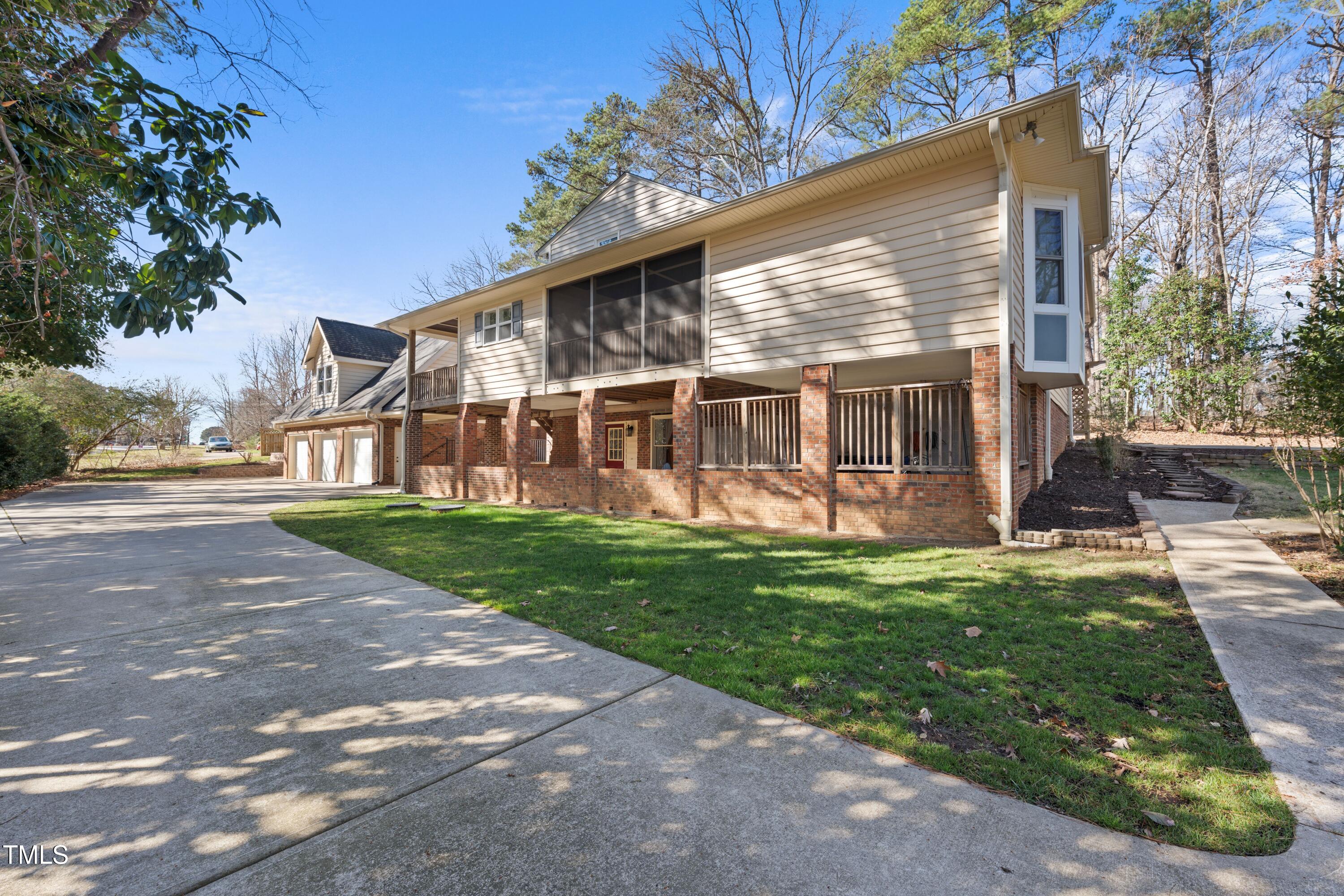 6301 King Lawrence Road Raleigh, NC 27607 - Photo 2 of 79 a view of a house with a yard
