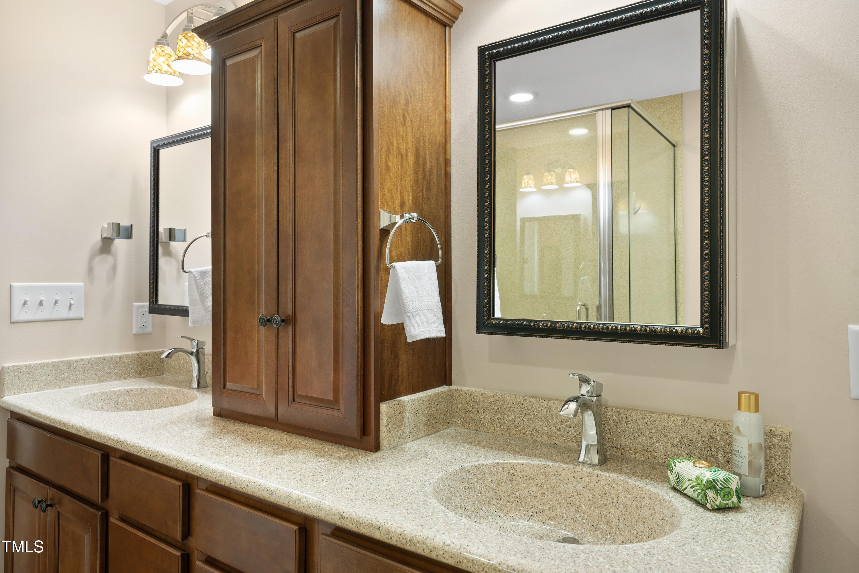 6301 King Lawrence Road Raleigh, NC 27607 - Photo 32 of 79 a bathroom with a sink and a mirror