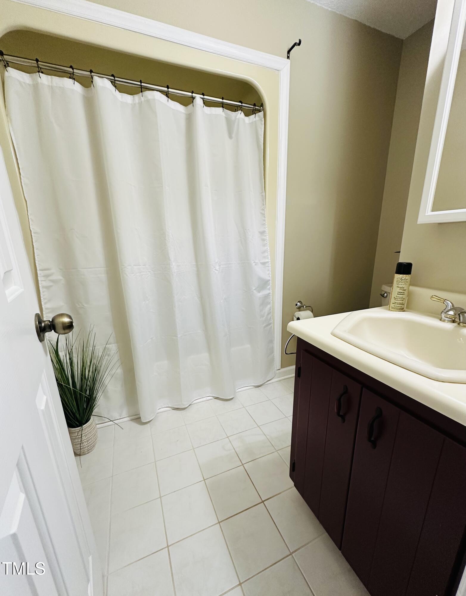 6301 King Lawrence Road Raleigh, NC 27607 - Photo 36 of 79 a bathroom with a sink and a mirror