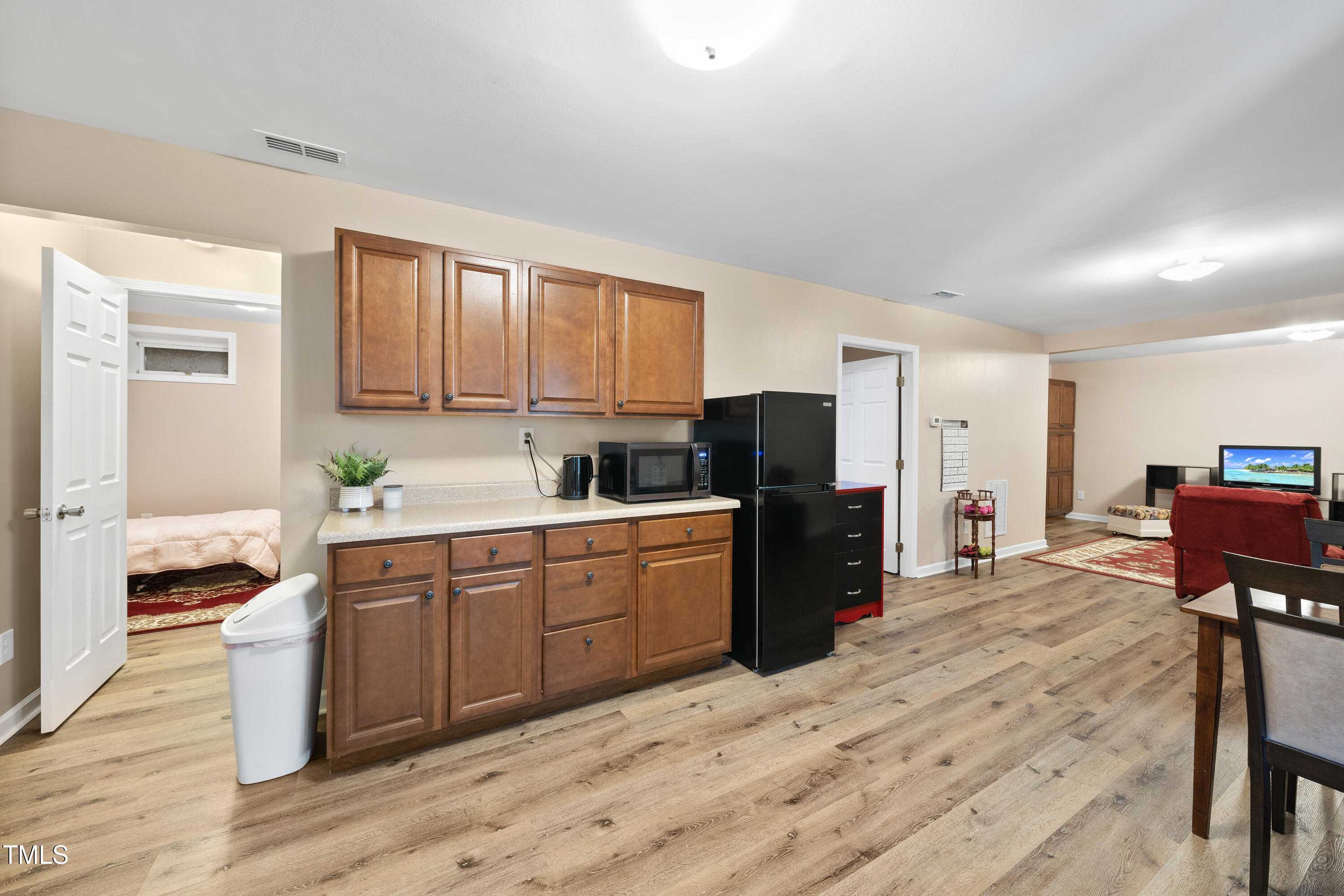 6301 King Lawrence Road Raleigh, NC 27607 - Photo 55 of 79 a kitchen with stainless steel appliances kitchen island granite countertop a refrigerator and a stove top oven