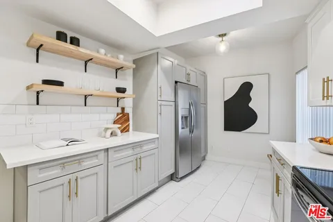 a kitchen with a sink and cabinets