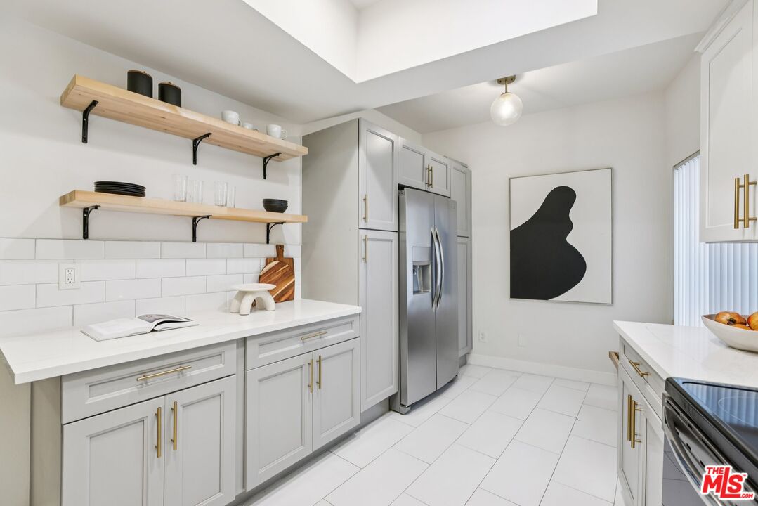 4242 Stansbury Avenue, Unit 104 Sherman Oaks, CA 91423 - Photo 17 of 38 a kitchen with a sink and cabinets