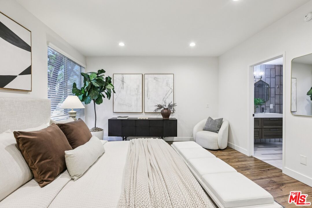 4242 Stansbury Avenue, Unit 104 Sherman Oaks, CA 91423 - Photo 20 of 38 a bedroom with bed and a couch