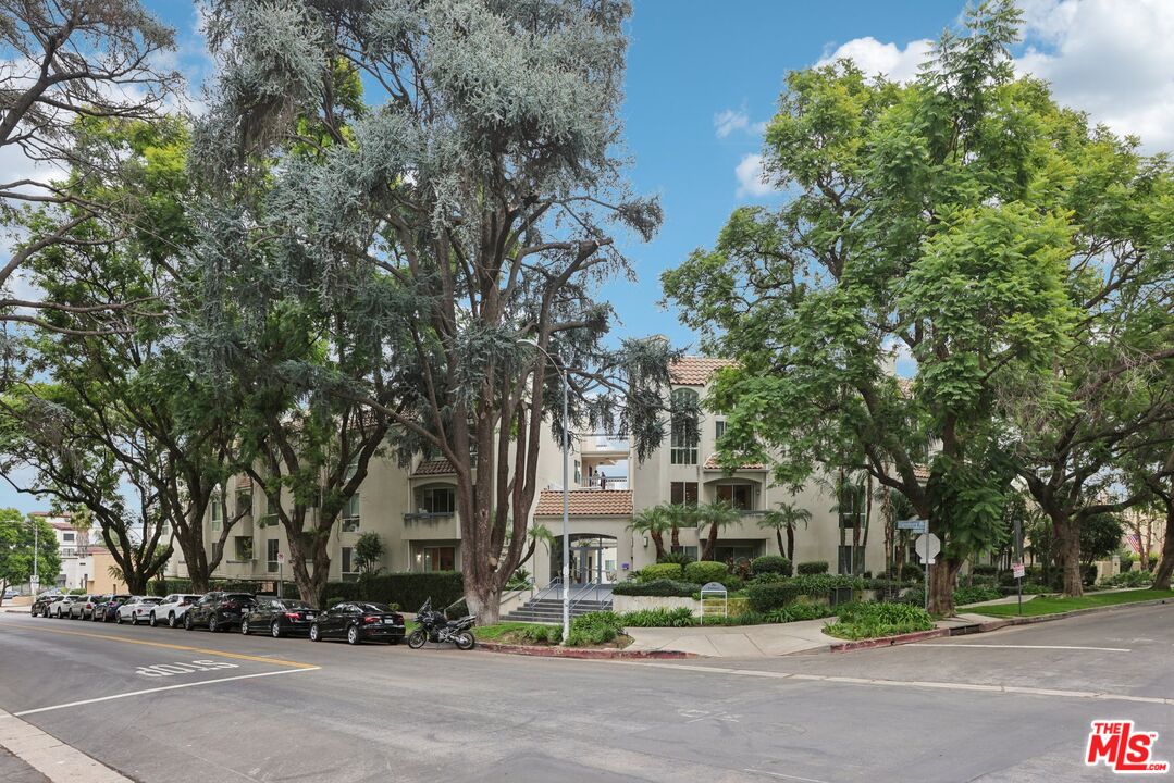 4242 Stansbury Avenue, Unit 104 Sherman Oaks, CA 91423 - Photo 2 of 38 a view of road and trees