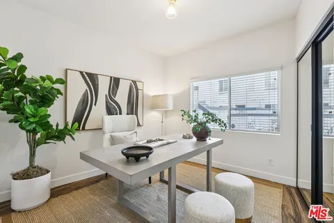 a living room with furniture potted plant and a potted plant