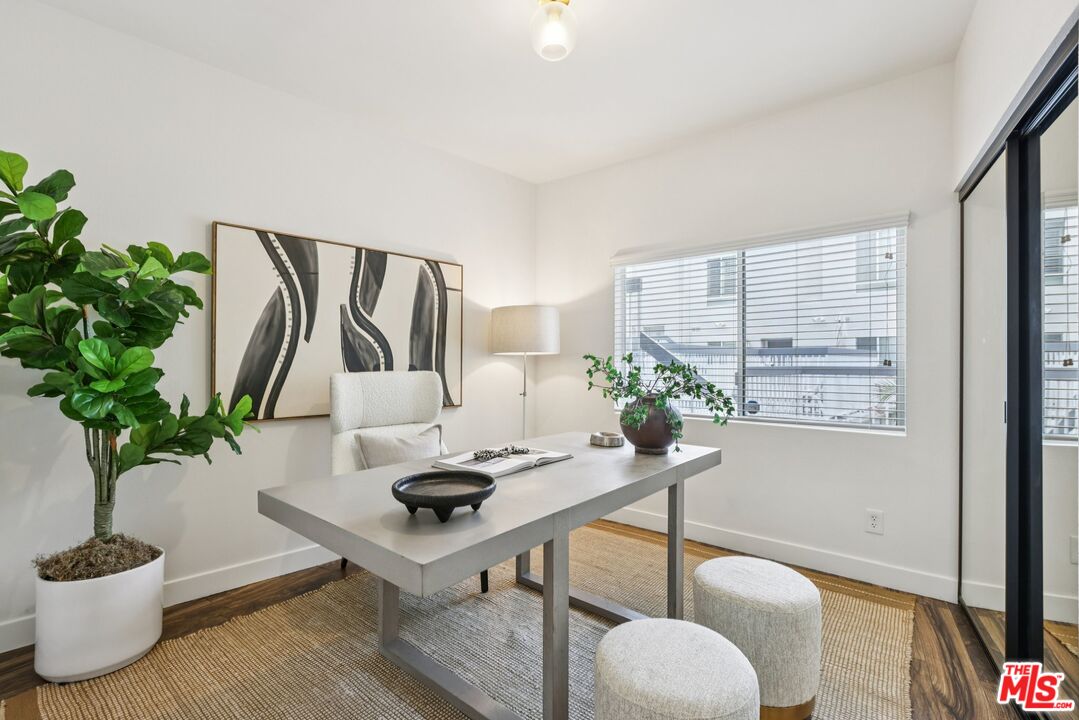 4242 Stansbury Avenue, Unit 104 Sherman Oaks, CA 91423 - Photo 27 of 38 a living room with furniture potted plant and a potted plant
