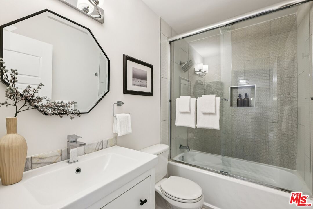 4242 Stansbury Avenue, Unit 104 Sherman Oaks, CA 91423 - Photo 30 of 38 a bathroom with a sink a toilet and shower