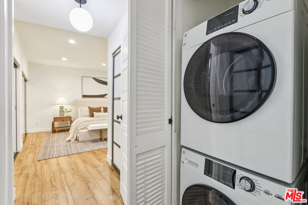 4242 Stansbury Avenue, Unit 104 Sherman Oaks, CA 91423 - Photo 31 of 38 a view of a bedroom with washer and dryer