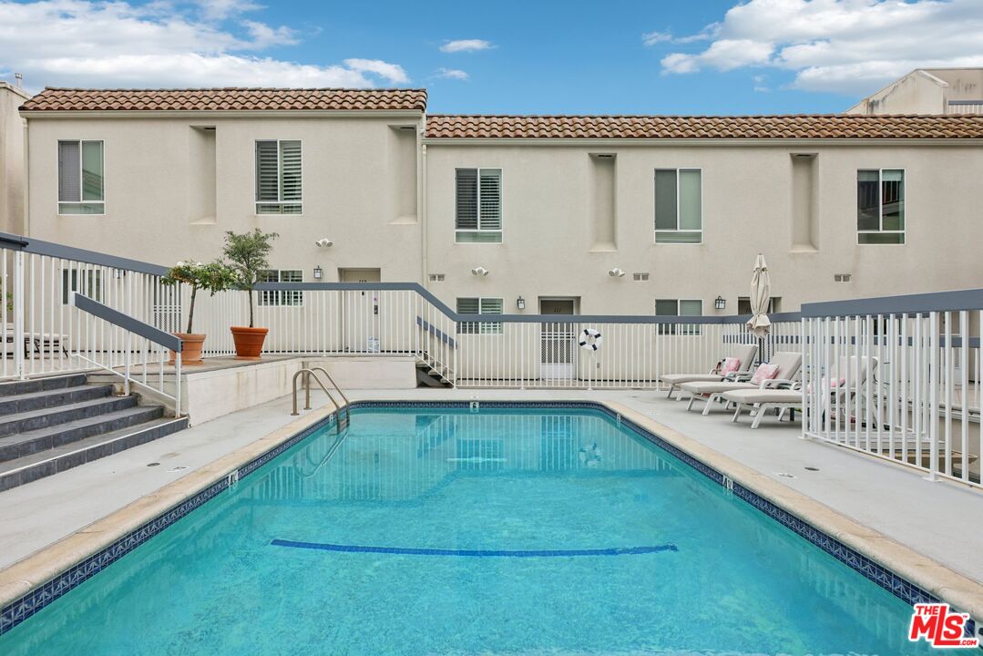 4242 Stansbury Avenue, Unit 104 Sherman Oaks, CA 91423 - Photo 32 of 38 a view of a kitchen with a large window and furniture