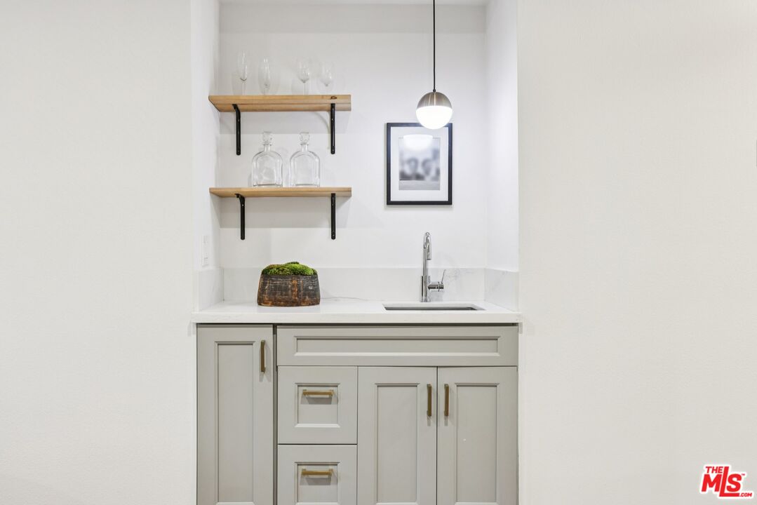 4242 Stansbury Avenue, Unit 104 Sherman Oaks, CA 91423 - Photo 7 of 38 a sink sitting next to a bathroom sink