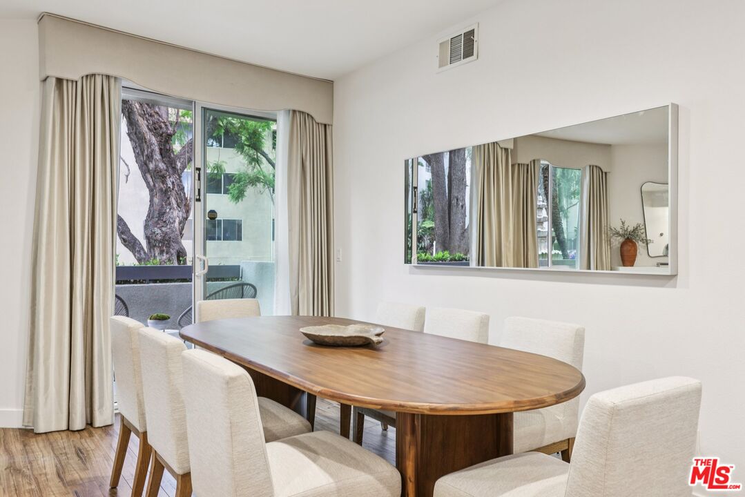 4242 Stansbury Avenue, Unit 104 Sherman Oaks, CA 91423 - Photo 10 of 38 a dining room with furniture and window