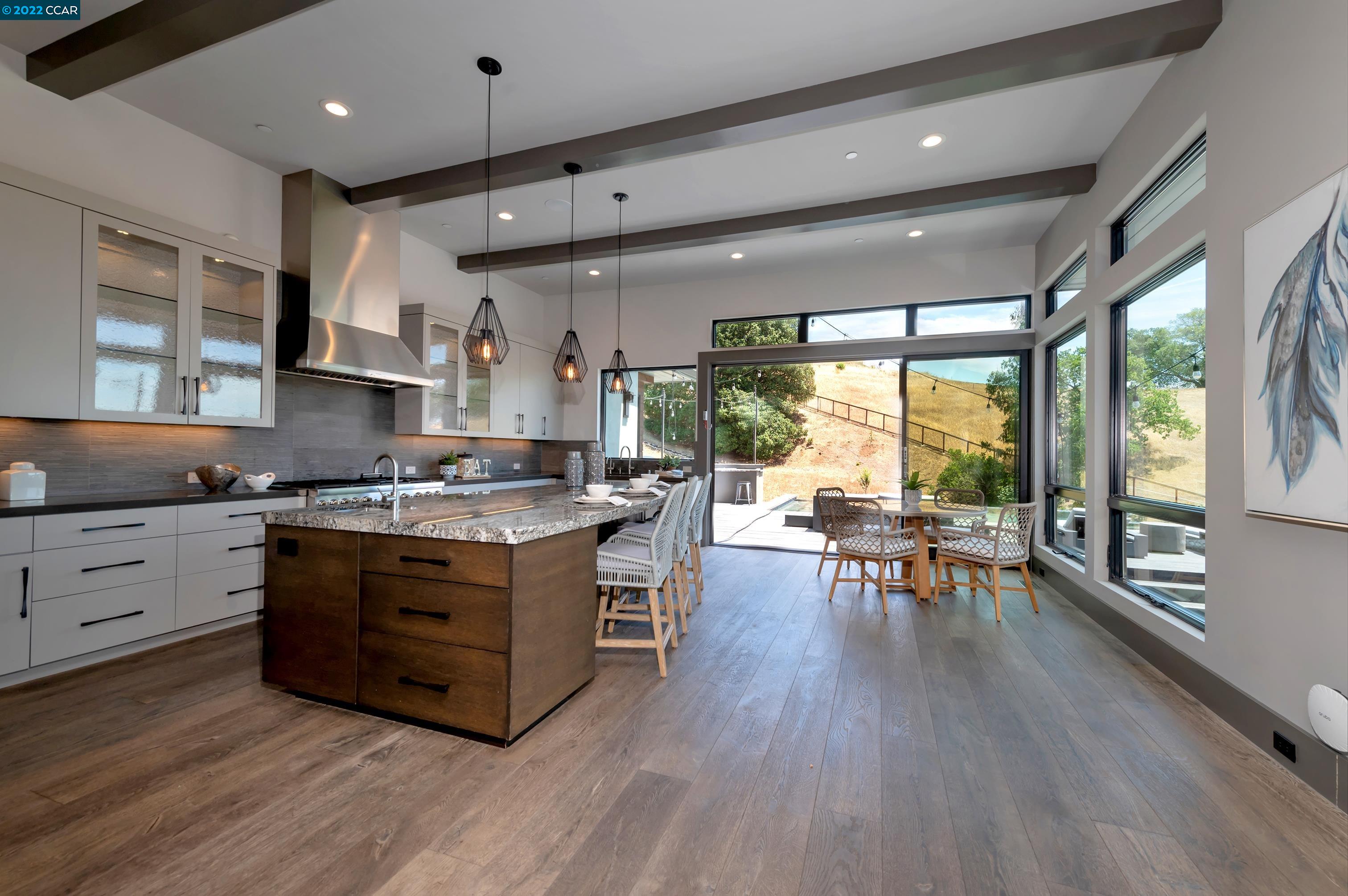 155 Arbor View Lane Lafayette, CA 94549 - Photo 19 of 32 a kitchen with stainless steel appliances granite countertop a stove and a wooden floors