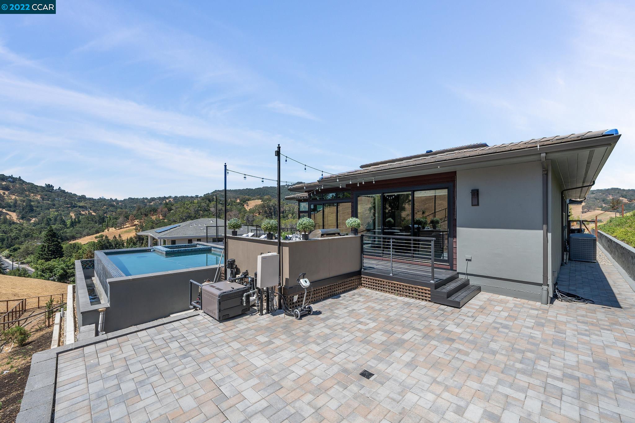 155 Arbor View Lane Lafayette, CA 94549 - Photo 3 of 32 a view of a terrace with a table and chairs