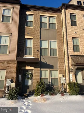 a view of a brick building next to a yard
