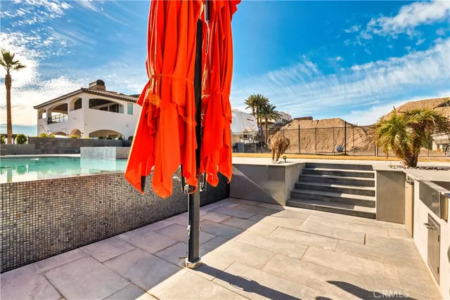 a view of a swimming pool with a lounge chairs