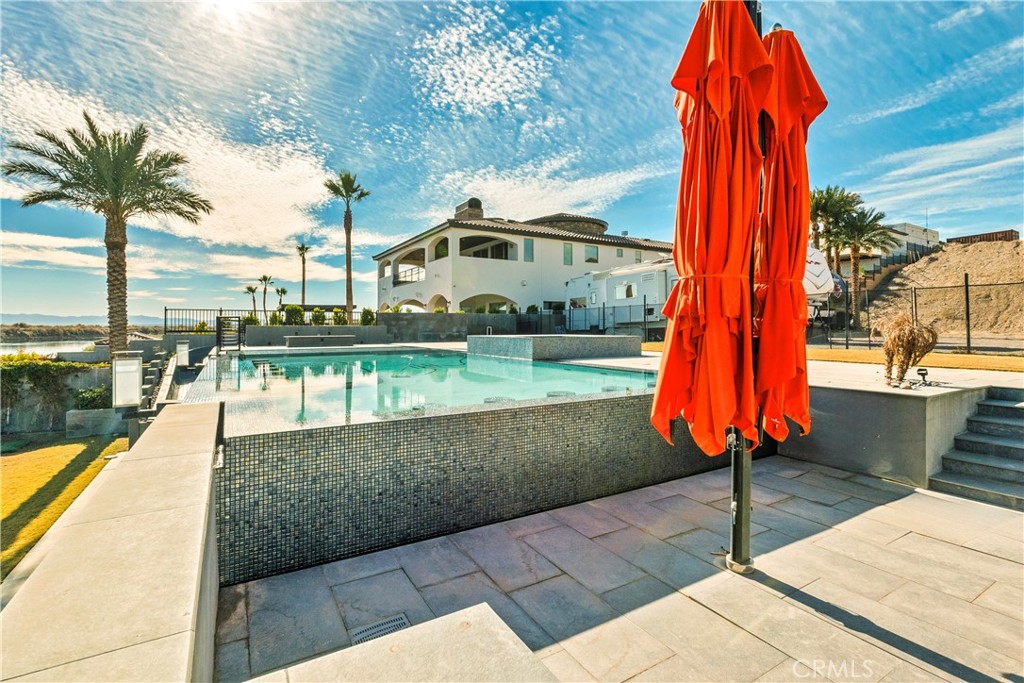 4618 My Place Road Needles, CA 92363 - Photo 12 of 31 a view of a swimming pool with a lounge chairs