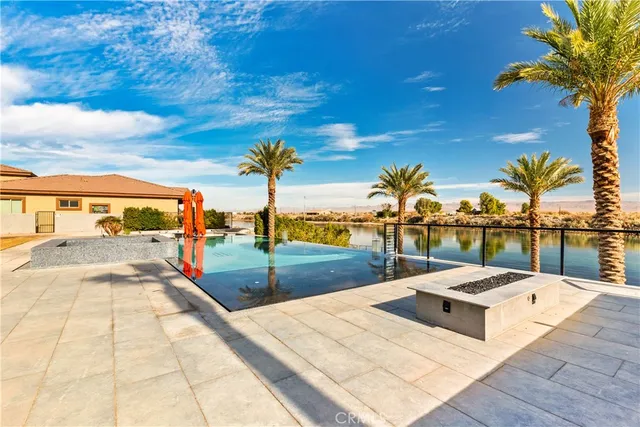 a view of a swimming pool with a lounge chair