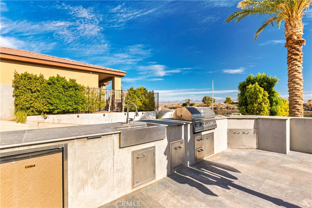 4618 My Place Road Needles, CA 92363 - Photo 8 of 31 a kitchen with stainless steel appliances granite countertop a stove and a sink