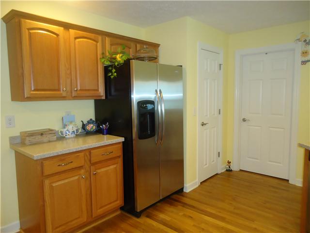 3281 Noah Road Beechgrove, TN 37018 - Photo 12 of 20 Additional cabinets surround the stainless steel refrigerator. You enter the pantry and the utility room from the kitchen and you will be impressed by the size.