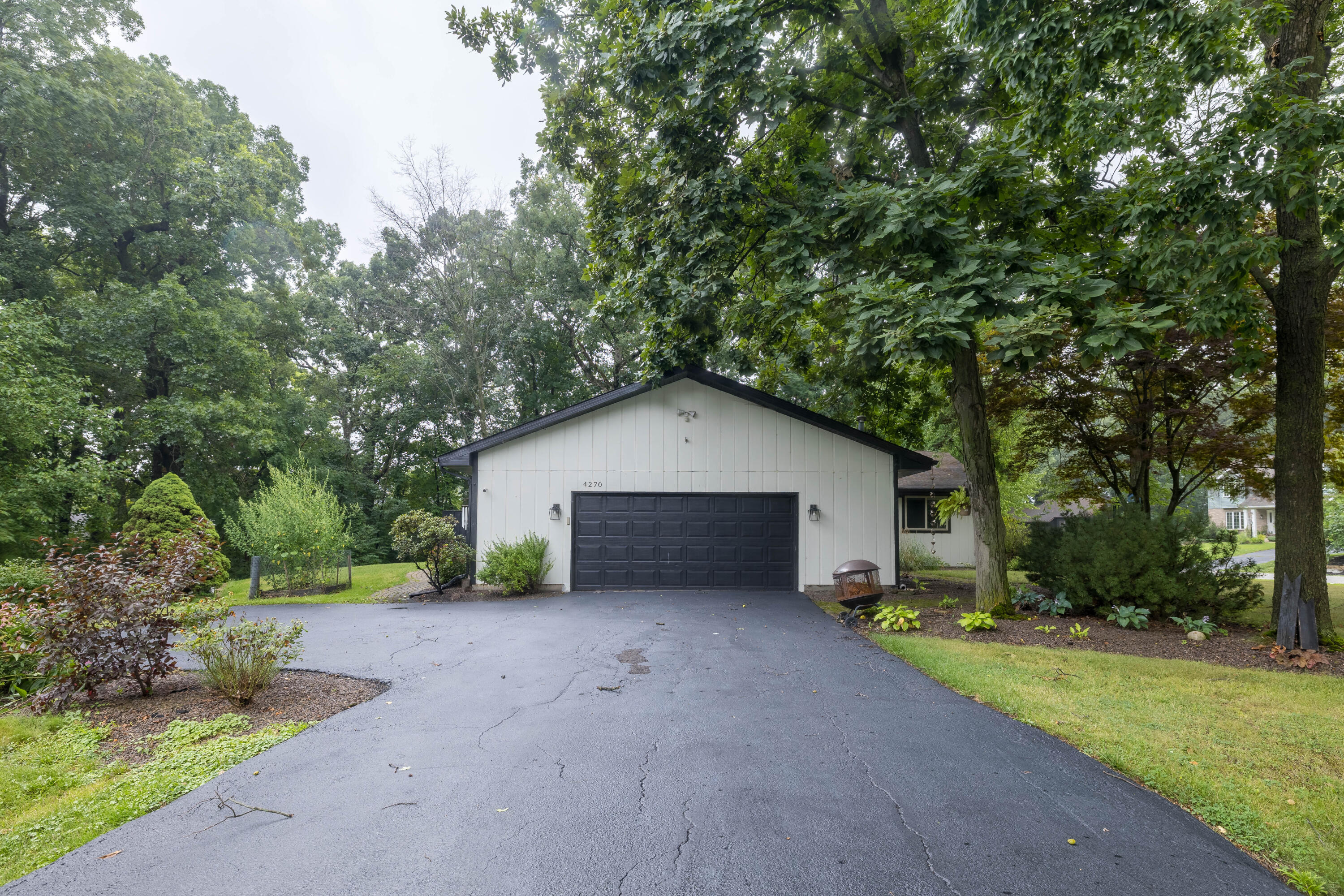 4270 Park Place Crown Point, IN 46307 - Photo 12 of 36 a view of a house with a yard and large tree