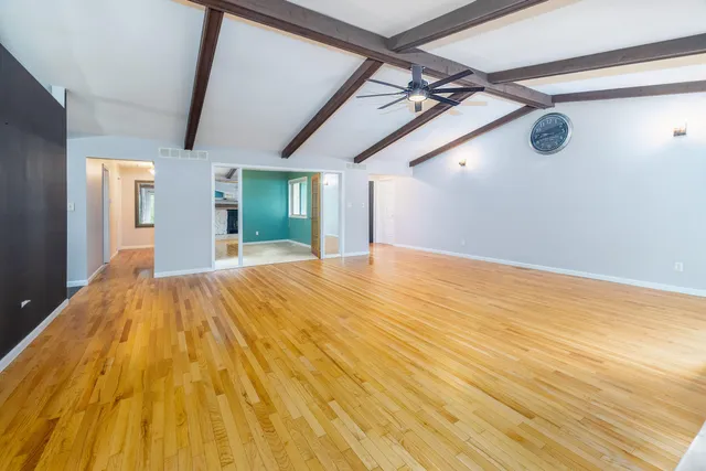 a view of a big room with wooden floor