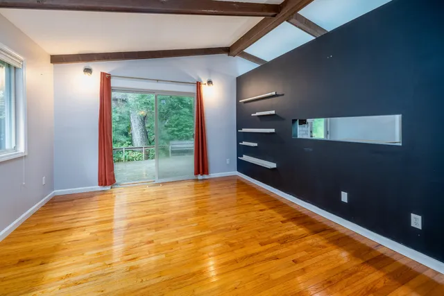 a view of an empty room with a window