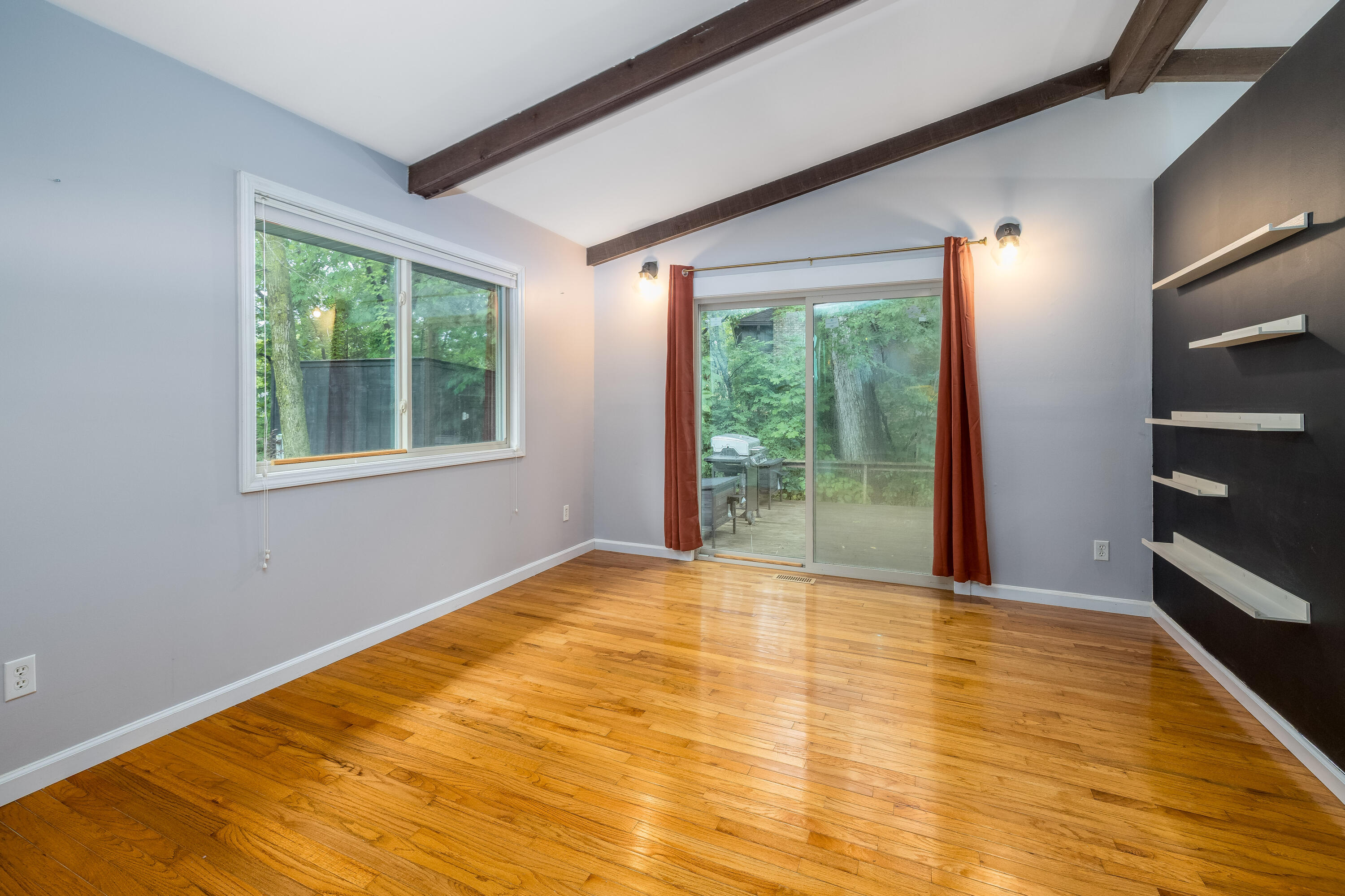 4270 Park Place Crown Point, IN 46307 - Photo 18 of 36 a view of an empty room with wooden floor and a window