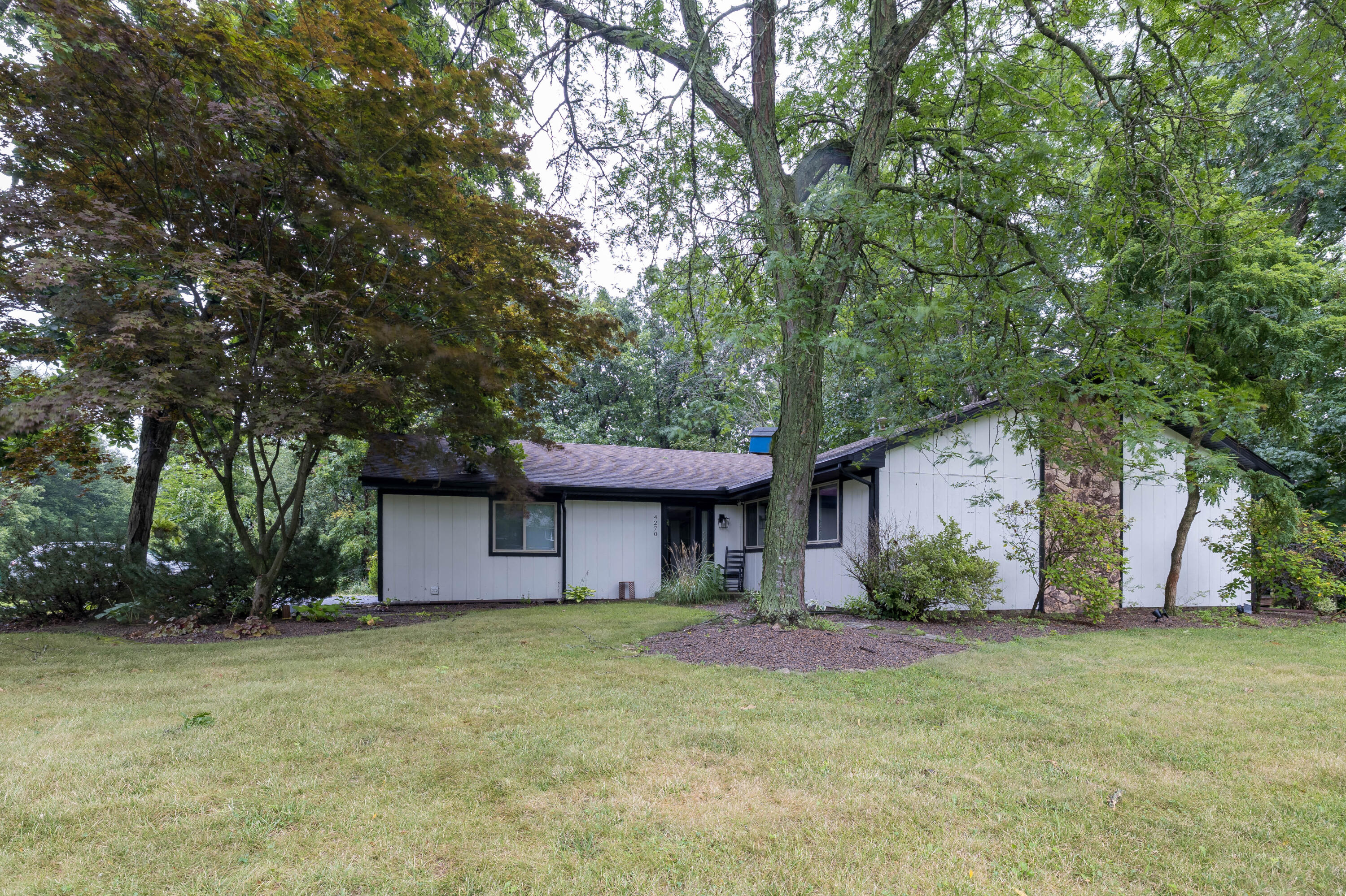 4270 Park Place Crown Point, IN 46307 - Photo 2 of 36 a front view of a house with garden