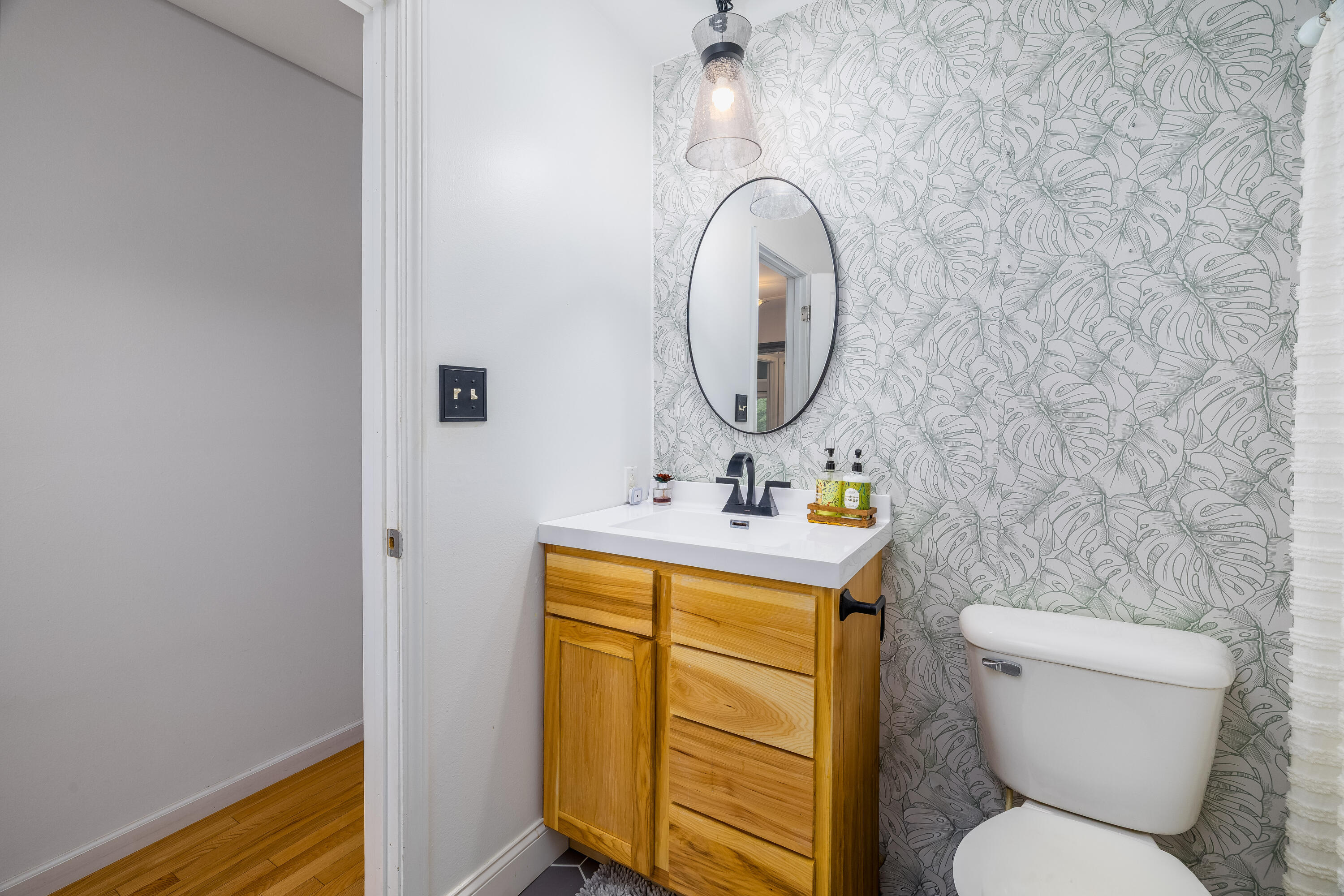 4270 Park Place Crown Point, IN 46307 - Photo 24 of 36 a bathroom with a toilet sink and mirror