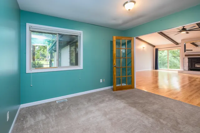 a view of an empty room with a window