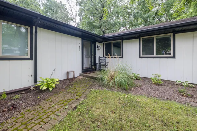 a house with trees in the background