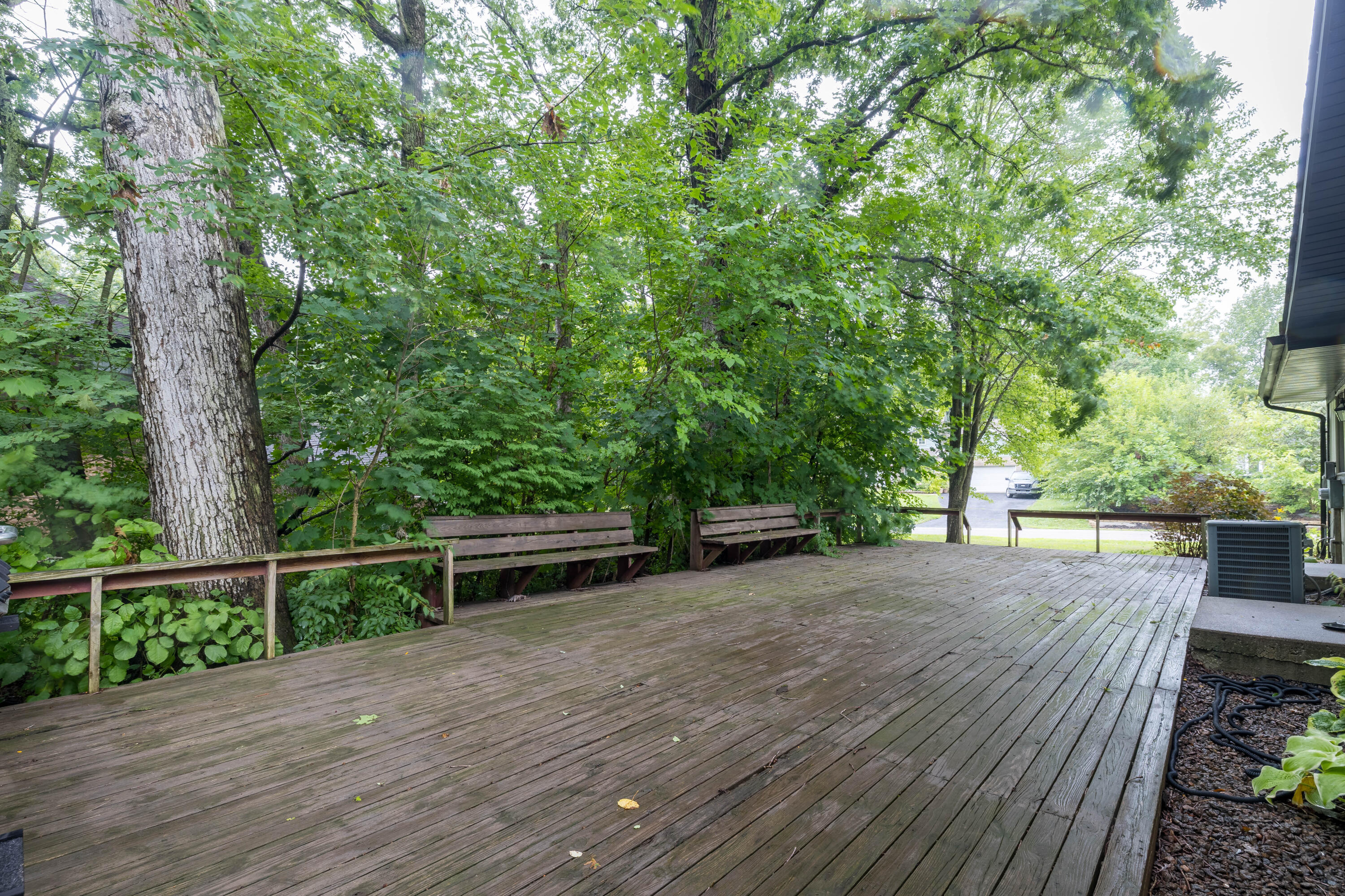 4270 Park Place Crown Point, IN 46307 - Photo 7 of 36 a view of a backyard with wooden floor and fence