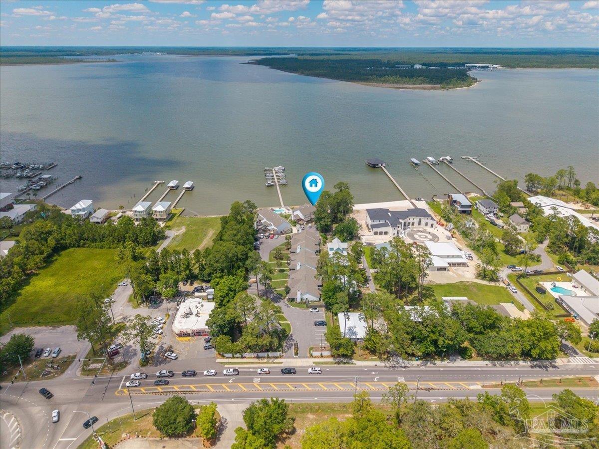 26063 Canal Road, Unit 3F Orange Beach, AL 36561 - Photo 69 of 72 a view of a lake with a building in the background