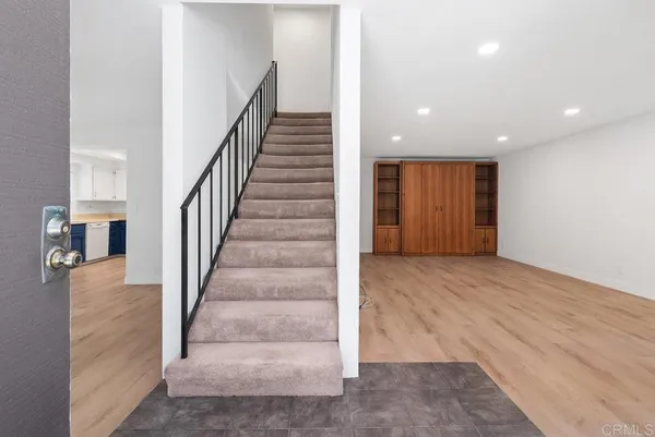 a view of an entryway with wooden floor