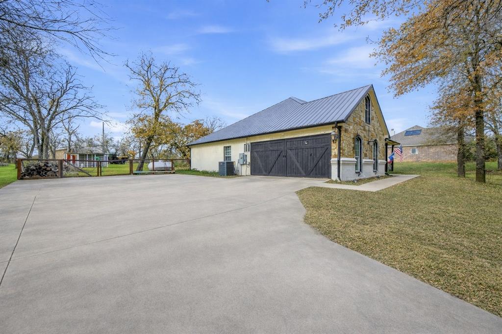 a view of a house with snow on the road