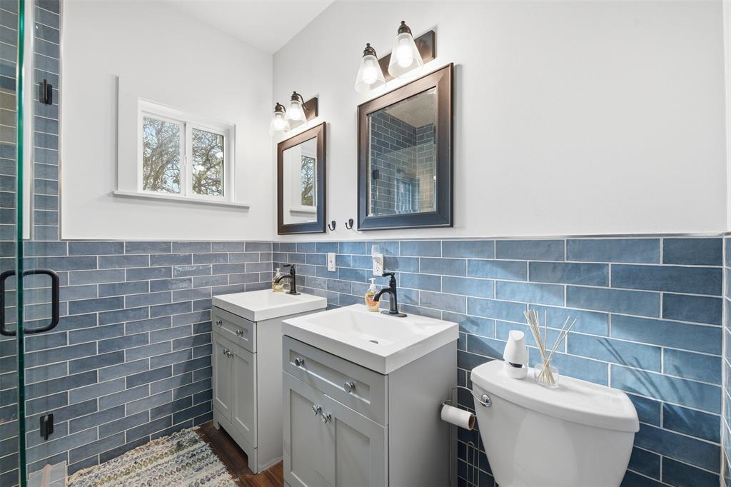 156 Howard Newby Lane Springtown, TX 76082 - Photo 9 of 11 a bathroom with a toilet sink and mirror