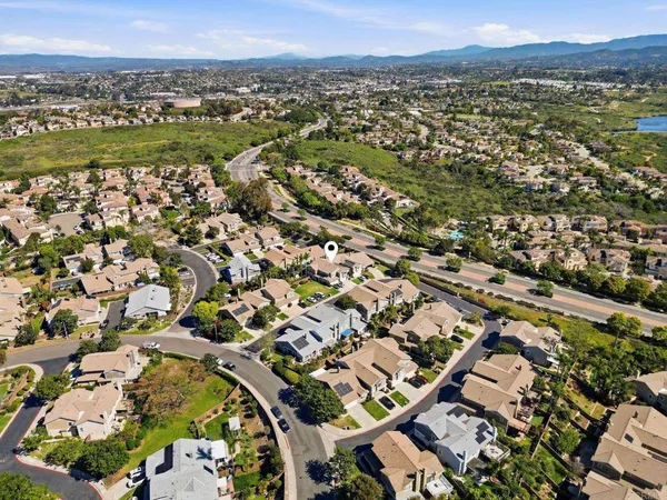 an aerial view of a city with lots of residential buildings