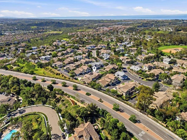 an aerial view of a residential houses with outdoor space