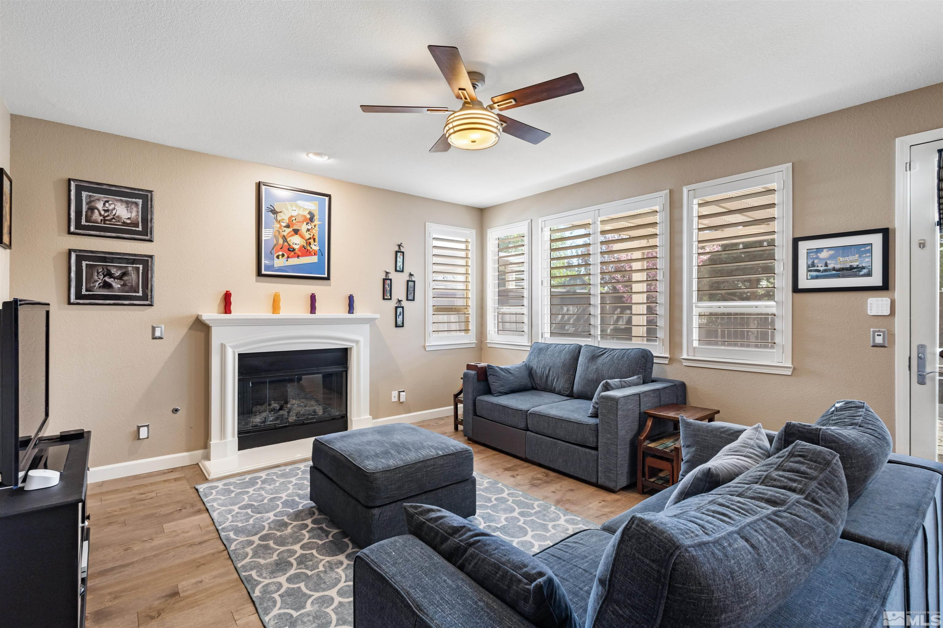 14025 Tagor Road Reno, NV 89521 - Photo 13 of 39 a living room with furniture or window and a fireplace